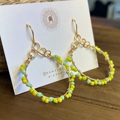 Citrus Wire Wrapped Hoop Earrings Yellow Beaded Earrings With Ear Wire For Summer, Green Hoop Earrings For The Beach, Green Hoop Earrings For Beach, Summer Yellow Beaded Earrings With Ear Wire, Bohemian Gold Hoop Earrings For Spring, Trendy Yellow Beaded Dangle Earrings, Bohemian Yellow Hoop Earrings, Green Hoop Earrings For Gifts, Green Hoop Earrings As Summer Gift