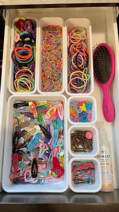 an organized drawer filled with lots of crafting supplies and toothbrushes in it