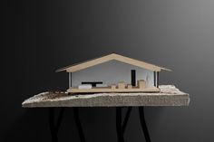 a model house sitting on top of a table