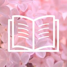 an open book surrounded by pink flowers