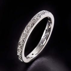 a white gold wedding ring with diamonds on the inside and outside, set in 18k white gold