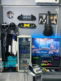 a room filled with lots of skateboards and various items on the wall next to a refrigerator