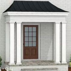 a white house with a brown front door and two planters on the side walk