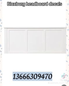 a white headboard with three doors and numbers on it