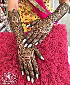 a woman with henna on her hands