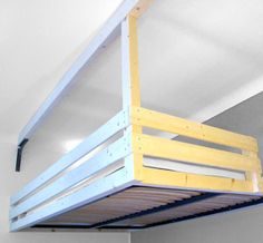 a loft bed with a ladder attached to it