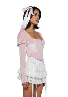 cuz be en pointe. This top has a velour construction, puffy long sleeves, a square neckline, structured boning, a decorative bow on the front, and a side zipper closure. Long Sleeve With Corset On Top, Pink Ruffle Top, Coquette Winter, Long Sleeve Corset Top, Long Sleeve Corset, Ballet Core, Sugar Thrillz, Free Socks, Pink Ruffle