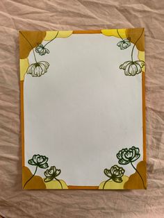 a paper with flowers on it sitting on a table