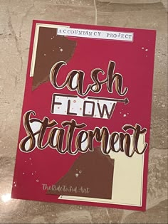 a red and white sign that says cash flow statement on the side of a wall