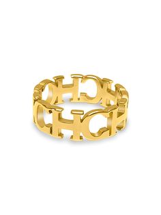 a yellow gold ring with the word hope in two letters on top of each other