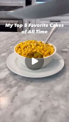 a white bowl filled with food on top of a counter