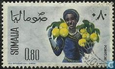 a stamp with an image of a woman holding lemons