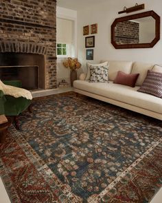 a living room filled with furniture and a fire place