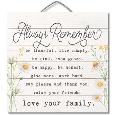 a sign that says, always remember be grateful live simply be kind show grace give more work hard to say please and thank you value your family