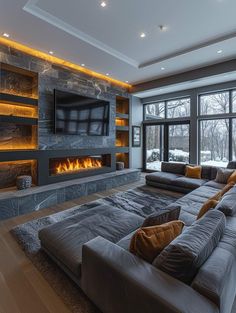 a living room with a large couch and fireplace