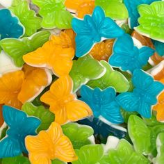 a pile of colorful butterfly shaped candies