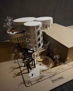 an architectural model of a building made out of cardboard