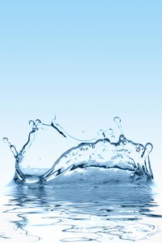 water splashing on the surface with blue sky in background