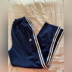 Adidas Navy Blue Tear Away. Nwot. Embroidered Logo, Metal Buttons. Casual Navy Pants With Three Stripes, Adidas Navy Cotton Bottoms, Casual Navy Adidas Pants, Adidas Blue Cotton Pants, Adidas Blue Cotton Bottoms, Blue Cotton Adidas Bottoms, Blue Cotton Pants With Three Stripes, Blue Adidas Cotton Sweatpants, Adidas Blue Cotton Sweatpants