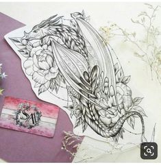 a drawing of a dragon with flowers on it's back and some other items