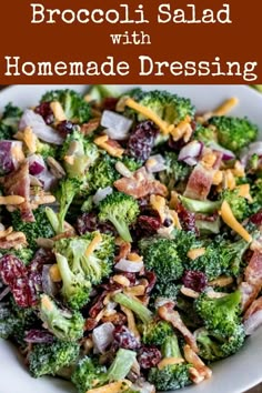 a white bowl filled with broccoli and cranberry salad on top of a wooden table