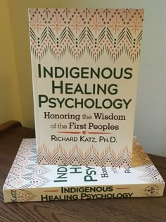 two books stacked on top of each other with the title indigenousus, healthing and psychic