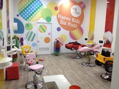 the children's hair salon has been decorated with bright colors and polka dot designs