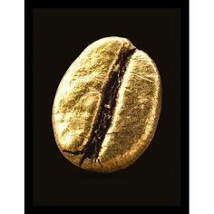 a close up of a coffee bean on a black background