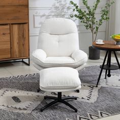 a white chair and ottoman in a living room