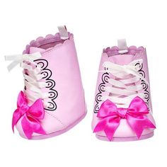 a pair of pink shoes with bows on them