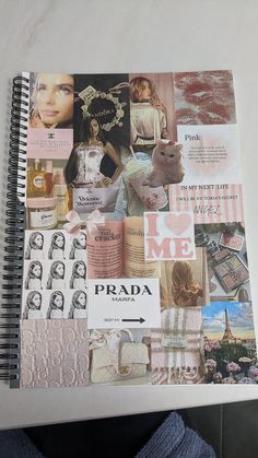 a person holding a notebook with many pictures on it and the words prada written in black