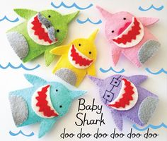 four baby shark dog toys in various colors and sizes, with the words baby shark on them