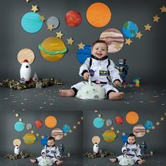 a baby sitting on the ground in front of space themed wallpapers and balloons