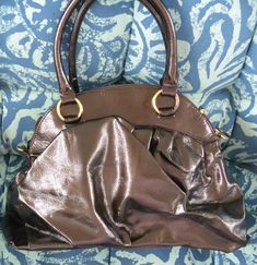 A fabulous vintage UNUSED original Big Buddha "Santa Barbara" Hobo handbag.  It comes in an elegant brown color with gold tone hardware and a stunning signature large flower on its front. It carries a Big Buddha fabric tag inside the bag and has three inner compartments (one zippered).  It is in great new condition. Perfect for lovers and collectors of Big Buddha designer bags. Wonderful addition of a rare retro new elegant Big Buddha "Santa Barbara" Hobo bag for your wardrobe or give it as a sp Big Buddha, Vintage Purses, Hobo Bags, Fabric Tags, Hobo Handbags, Santa Barbara, Hobo Bag, Designer Bags, Purses And Handbags