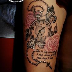 a tattoo with roses and a clock on the arm that says it's time to change