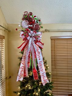 a christmas tree decorated with ribbons and candy canes