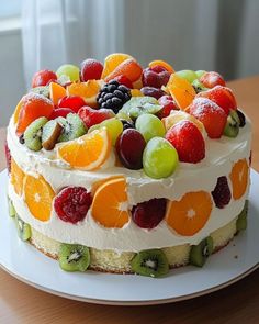 a cake with fruit on it sitting on top of a table