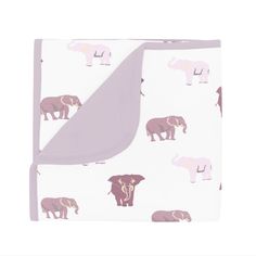 a blanket with elephants on it is shown in pink and purple colors, as well as an elephant print