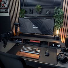 a computer desk with a keyboard, mouse and monitor sitting on it's side