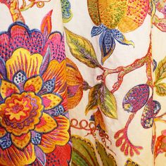 an image of colorful fabric with flowers on it