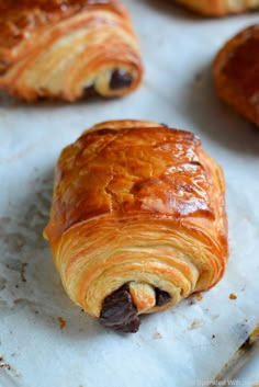 some croissants are on a baking sheet