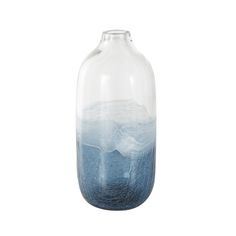 a glass vase with blue water and mountains in the bottom, on a white background