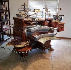 an old fashioned desk with many items on it