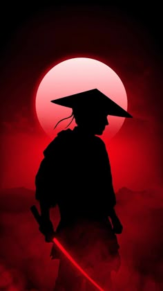 the silhouette of a person with a hat on in front of a red sun and clouds