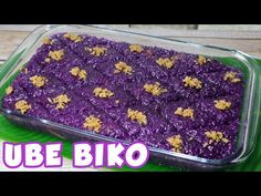 a casserole dish filled with purple and gold flakes on a green plate