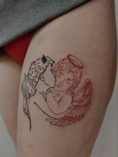 a woman with an angel tattoo on her thigh