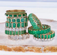 Our emerald eternity bands in 14K or 18K yellow, rose, and white gold are set with shimmering multi-colored sapphires and a bezel setting. Wear these alone or stacked with multi-colors and/or other rings from our collection. We have varying sizes in stock, you can order to your specific size of stones, colors and gold--most of our special order eternity bands can be completed with in a few days to one week. 14K Gold or 18K gold Multi-color sapphires and gemstones 23 emeralds (depending upon size Emerald Gemstone Eternity Band In Fine Jewelry Style, Emerald Eternity Band Fine Jewelry, Luxury Stackable Emerald Jewelry, Stackable Eternity Band With Emerald Cut, Luxury Stackable Emerald Cut Emerald Ring, Luxury Stackable Emerald-cut Emerald Ring, Eternity Band Stack, Stackable Gemstone Rings, Baguette Eternity Band