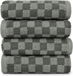 three towels stacked on top of each other in grey and white checkerboard pattern