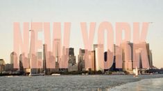 the words new york are in front of a large cityscape with tall buildings