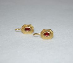 Cabochon garnets are set in 20K yellow gold in the Byzantine style. These earrings are perfect for everyday wear. A heirloom in the making. A simple yet timeless style. 20K yellow gold, lever back closure Byzantine Earrings, Byzantine Jewelry, Gold Cuffs, Diamond Rings Bands, Beads And Wire, Simple Jewelry, Buying Jewelry, Diamond Bands, Semiprecious Stones